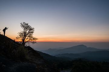 Twilight and morning sun at a viewpoint in the mountains of northern Thailand on a new day