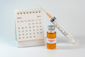 Coronavirus vaccine and medical syringe on white background
