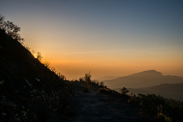 Twilight and morning sun at a viewpoint in the mountains of northern Thailand on a new day