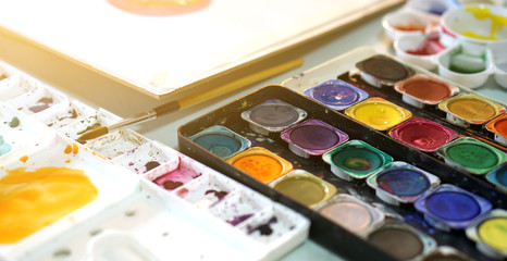 Naklejka premium palette watercolor paints and brushes, Tool to perform painting work