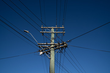 Under electric pole with clear blue sky at Oamaru, New Zealand.