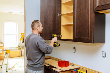 Installation of furniture hinges on the cabinet door