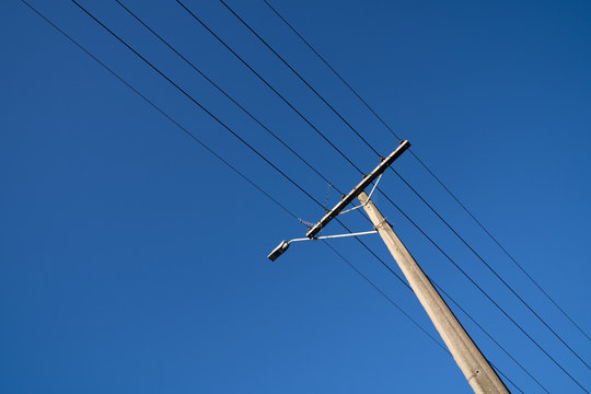 Under electric pole with clear blue sky at Oamaru, New Zealand.
