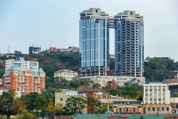Summer, 2015 - Vladivostok, Russia - The marine facade of Vladivostok. Residential and business buildings located on the green hills of the capital of the Far East, Vladivostok