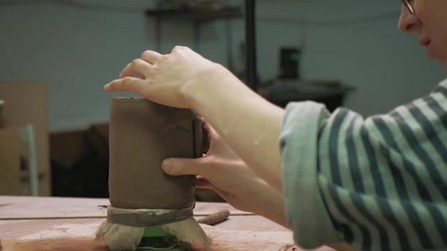 the work of a ceramist. making pottery