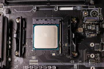 Close-up of a modern computer motherboard with installed cpu. Electronic computer hardware technology