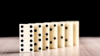 Dominoes standing in a row