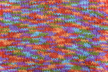 Fototapeta premium Bright colorful knitted pattern close-up look