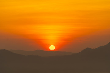 Fototapeta premium sunrise in the morning at Phutok hill view point, Chiangkhan, Loei Province, Thailand.
