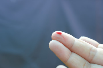 some blood from bleeding on one finger