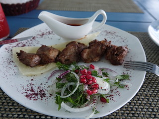 A national dish in Asia, barbecue in a cafe. Tajikistan