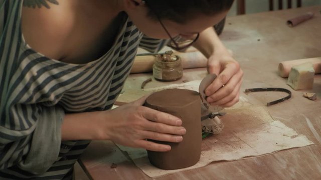 the work of a ceramist. making pottery