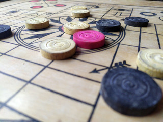 Carrom board or Karrom , carrom men, and queen. Close up - obrazy, fototapety, plakaty
