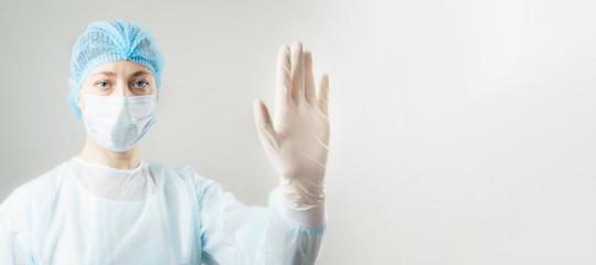 Woman in respirator showing stop gesture. stop viruses concept.