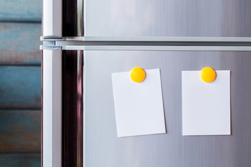 Abstract of Blank paper and stick paper on refrigerator door. paper note with magnet