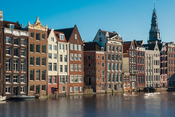 Dancing houses and Damrak canal in the centre of Amsterdam, the Netherlands 