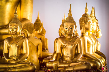Selective focus point on Face of gold buddha, Buddha statues, Culture Buddhist Thailand, Asia