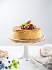 Happy birthday fresh fruit cheese cake with Happy birthday on cake concept with strawberry kiwi fruit cake. Food concept.