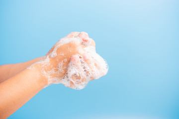 woman washing hands with soap have foam