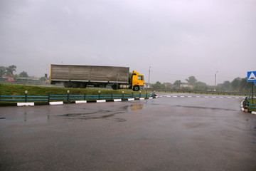 A truck is carrying cargo along the highway