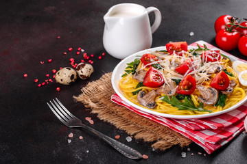 Spaghetti with mushrooms, cheese, spinach, rukkola and cherry tomatoes