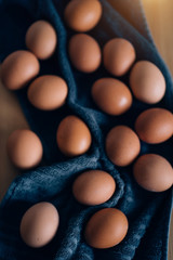 Raw chicken eggs on table