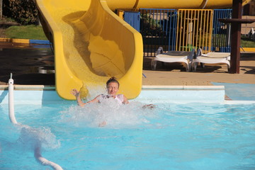 The girl has fun at the water Park