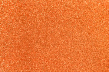 Orange glitter shiny texture background for christmas, Celebration concept.