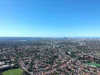 Drone panoramic aerial view of Sydney NSW Australia city Skyline and looking down on all suburbs 