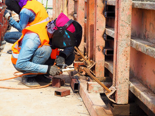 Welding work ,worker with protective welding metal on construction