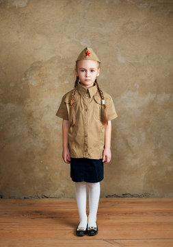 Little girl in uniform, May 9 Victory Day.
