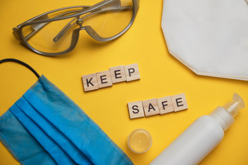 safety first concept with personal protection for workers on bright yellow background