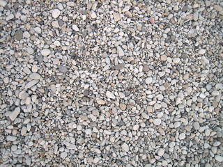 Endless dry sea pebbles, texture, background.