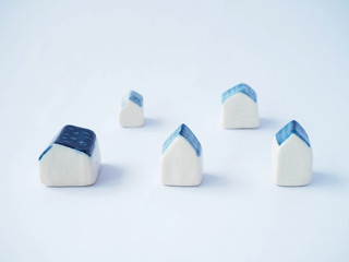 White ceramic small house and space for your text