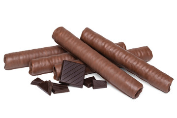 A heap of wafer rolls in chocolate