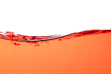 Red water splash and air bubbles on white background