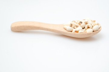 millet in a wooden bowl isolated on white