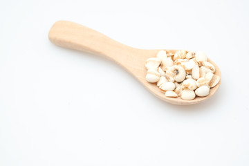 millet in a wooden bowl isolated on white