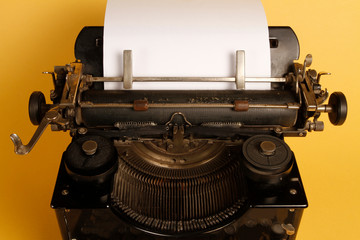 Fototapeta na wymiar Mechanical portable typewriter made in 1952. 1952 portable typewriter made of metal and lead material.