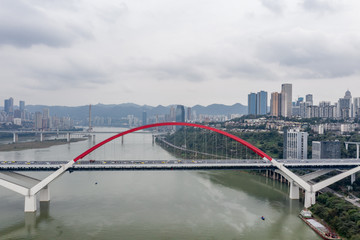 Aerial drone shot of Caiyuanba bridge over Jialing river in Chongqing, southwest China