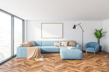Panoramic living room with blue sofa and poster