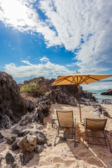 beach chairs and umbrella