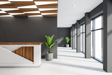 White reception desk in modern gray office