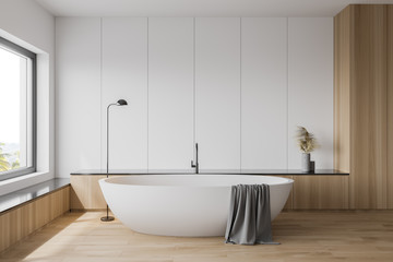 White and wooden bathroom interior with tub