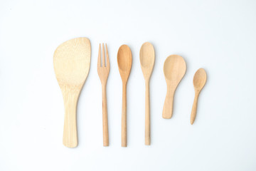 wooden spoon and fork on pastel color background