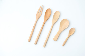 wooden spoon and fork on pastel color background