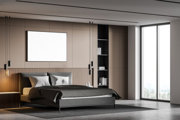 Beige bedroom corner with poster and window