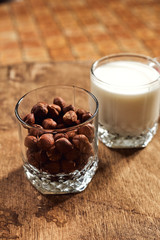 Yogurt with nuts on a wooden light background. Natural yogurt.