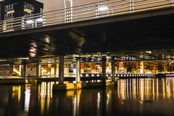 STOCKHOLM, SWEDEN A bridge on Sickla Canal at night in Hammarby Sjostad.