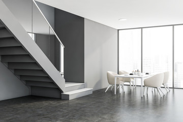 Panoramic gray dining room corner with stairs